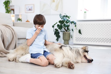 Photo of Boy suffering from allergy with her dog at home
