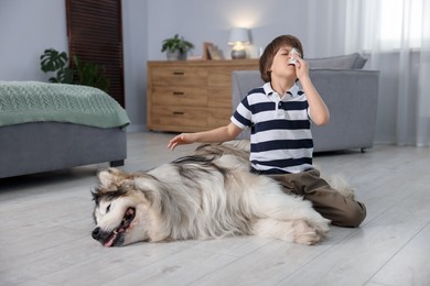 Photo of Boy suffering from allergy with her dog at home