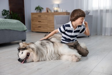 Photo of Boy suffering from allergy with her dog at home