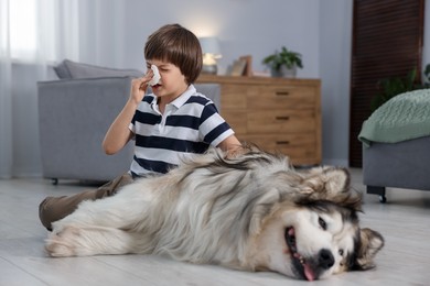 Photo of Boy suffering from allergy with her dog at home