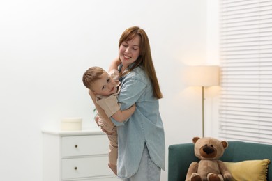 Photo of Happy mother spending time together with her son at home
