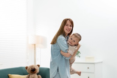 Photo of Happy mother spending time together with her son at home