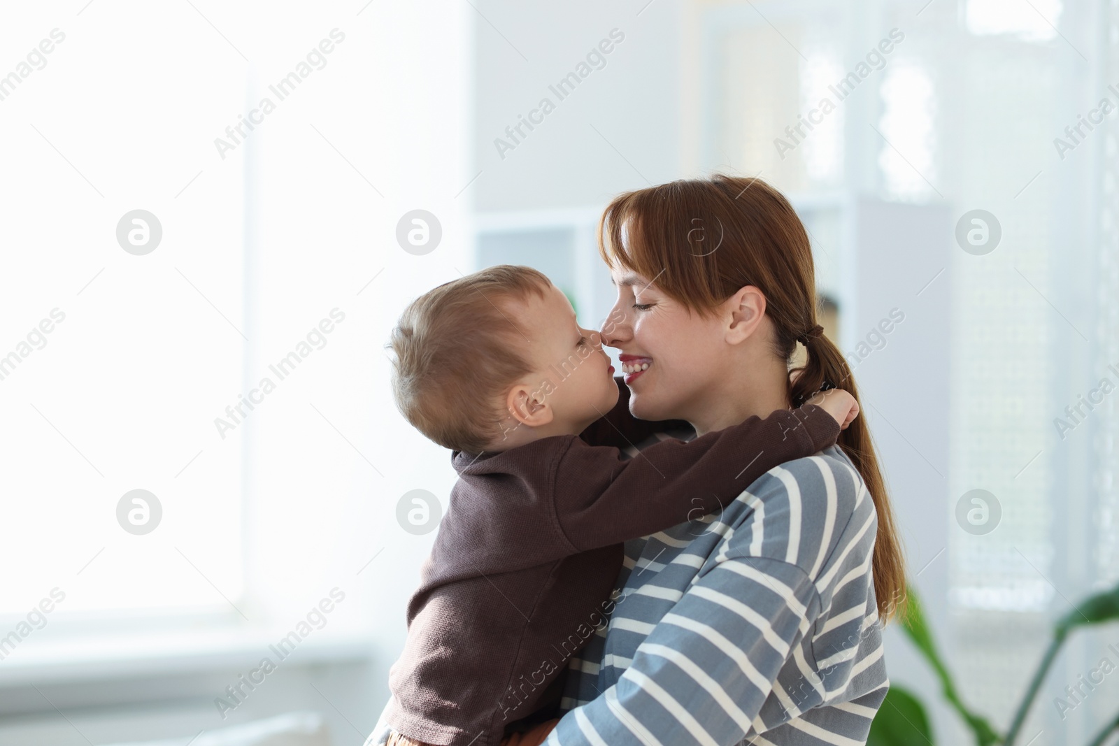 Happy mother spending time together with her son at home Photo of Happy mother spending time together with her son at home