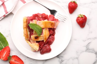 Photo of Tasty strawberry pie and berries on white marble table, flat lay