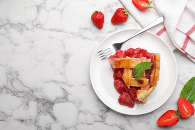Photo of Piece of tasty strawberry pie and berries on white marble table, flat lay. Space for text