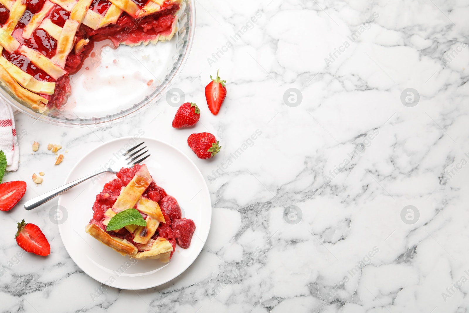 Tasty strawberry pie and berries on white marble table, flat lay. Space for text Photo of Tasty strawberry pie and berries on white marble table, flat lay. Space for text
