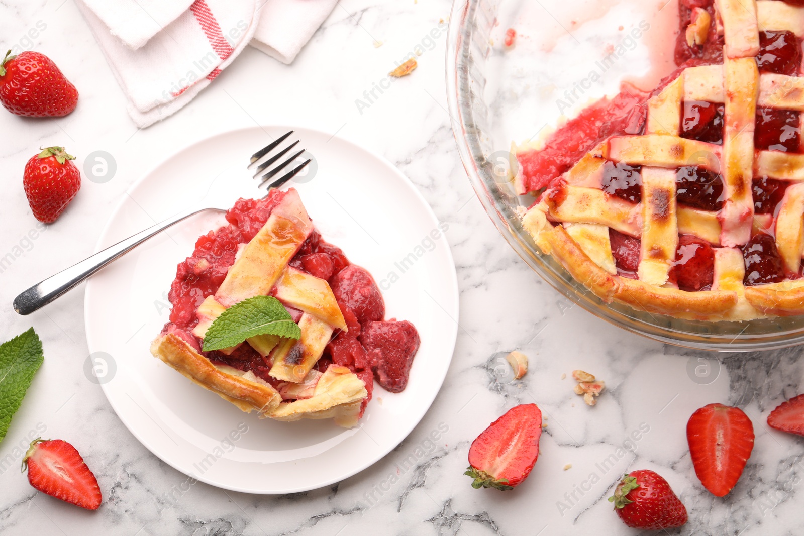 Tasty strawberry pie and berries on white marble table, flat lay Photo of Tasty strawberry pie and berries on white marble table, flat lay