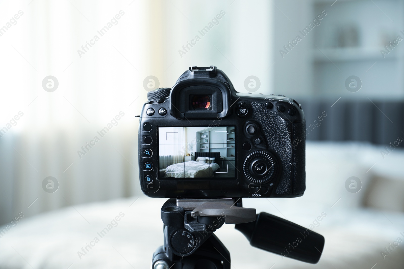 Shooting large bed with professional photo camera in studio, selective focus Photo of Shooting large bed with professional photo camera in studio, selective focus