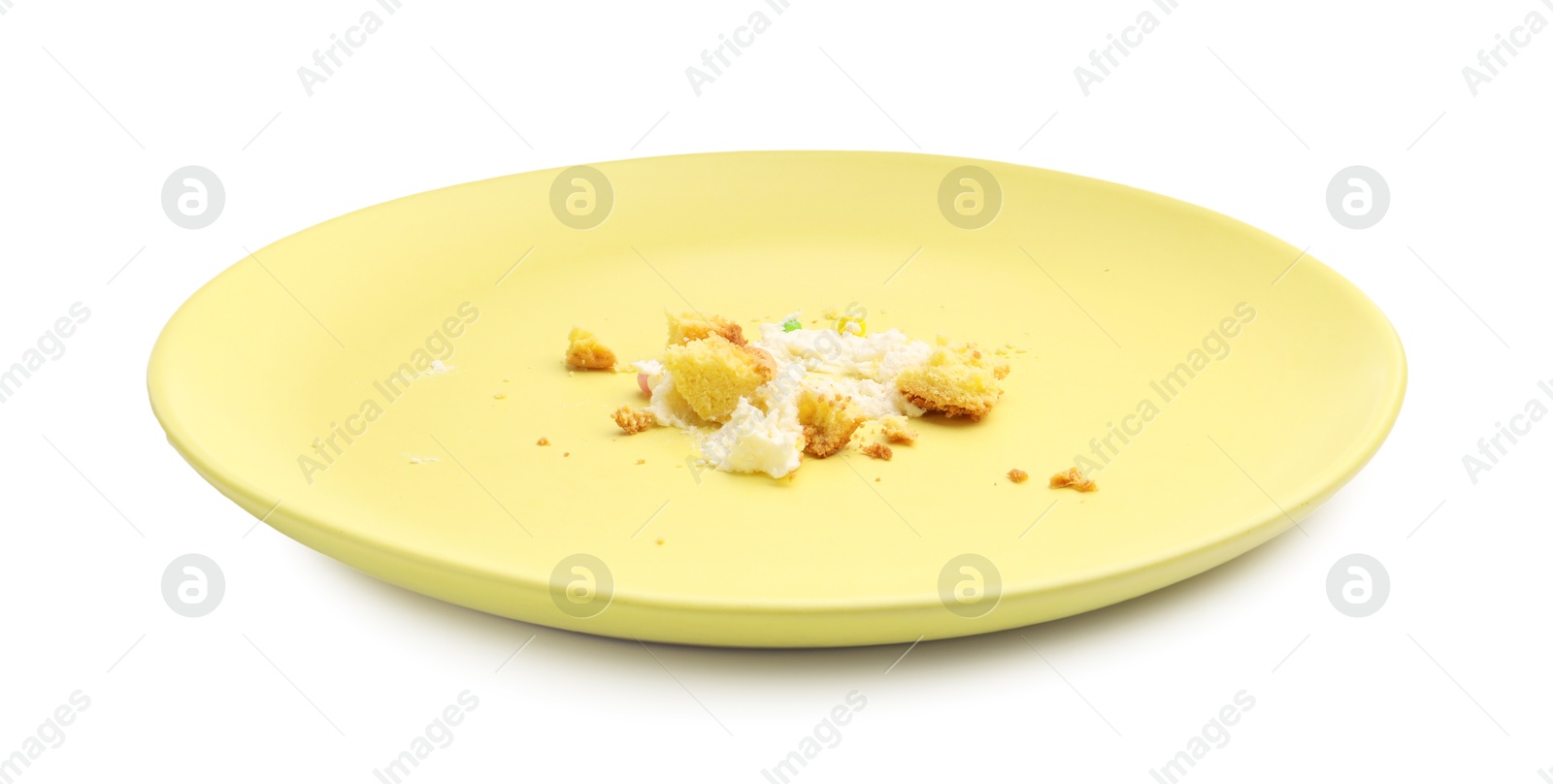 Dirty plate with crumbs and cream isolated on white Photo of Dirty plate with crumbs and cream isolated on white