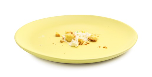Photo of Dirty plate with crumbs and cream isolated on white
