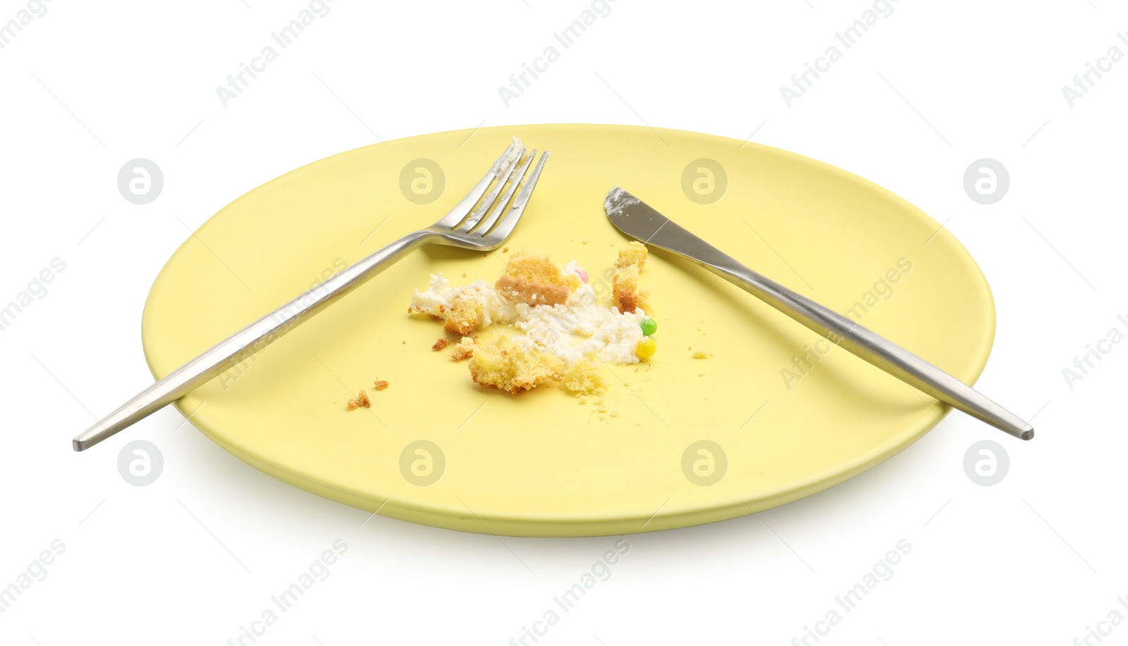 Dirty plate with crumbs, cream and cutlery isolated on white Photo of Dirty plate with crumbs, cream and cutlery isolated on white