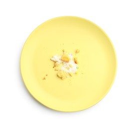 Photo of Dirty plate with crumbs and cream isolated on white, top view