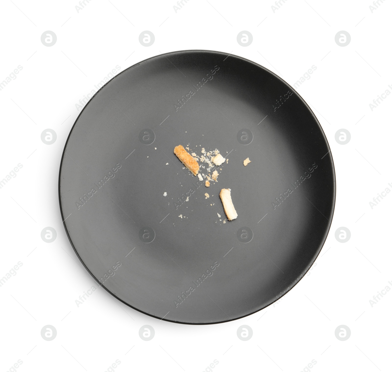 Dirty plate with bread crumbs isolated on white, top view Photo of Dirty plate with bread crumbs isolated on white, top view