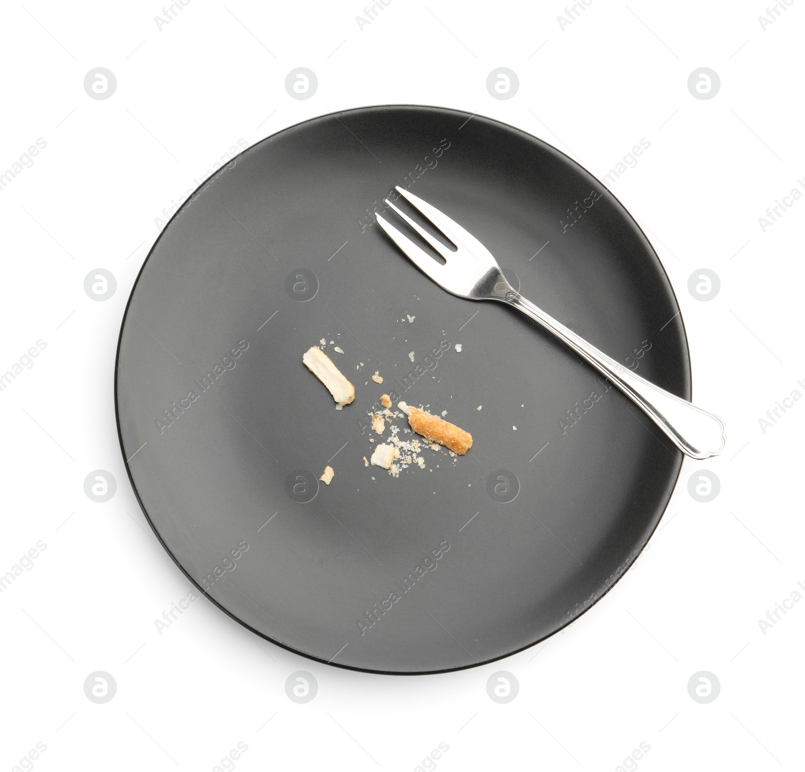 Dirty plate with bread crumbs and fork isolated on white, top view Photo of Dirty plate with bread crumbs and fork isolated on white, top view