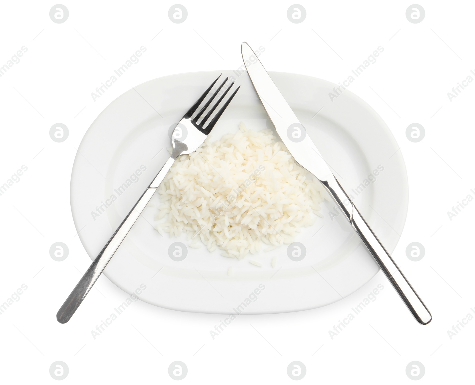 Plate with cooked rice and cutlery isolated on white, top view Photo of Plate with cooked rice and cutlery isolated on white, top view