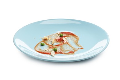 Photo of Dirty plate with tomato sauce, peas and bread crumbs isolated on white