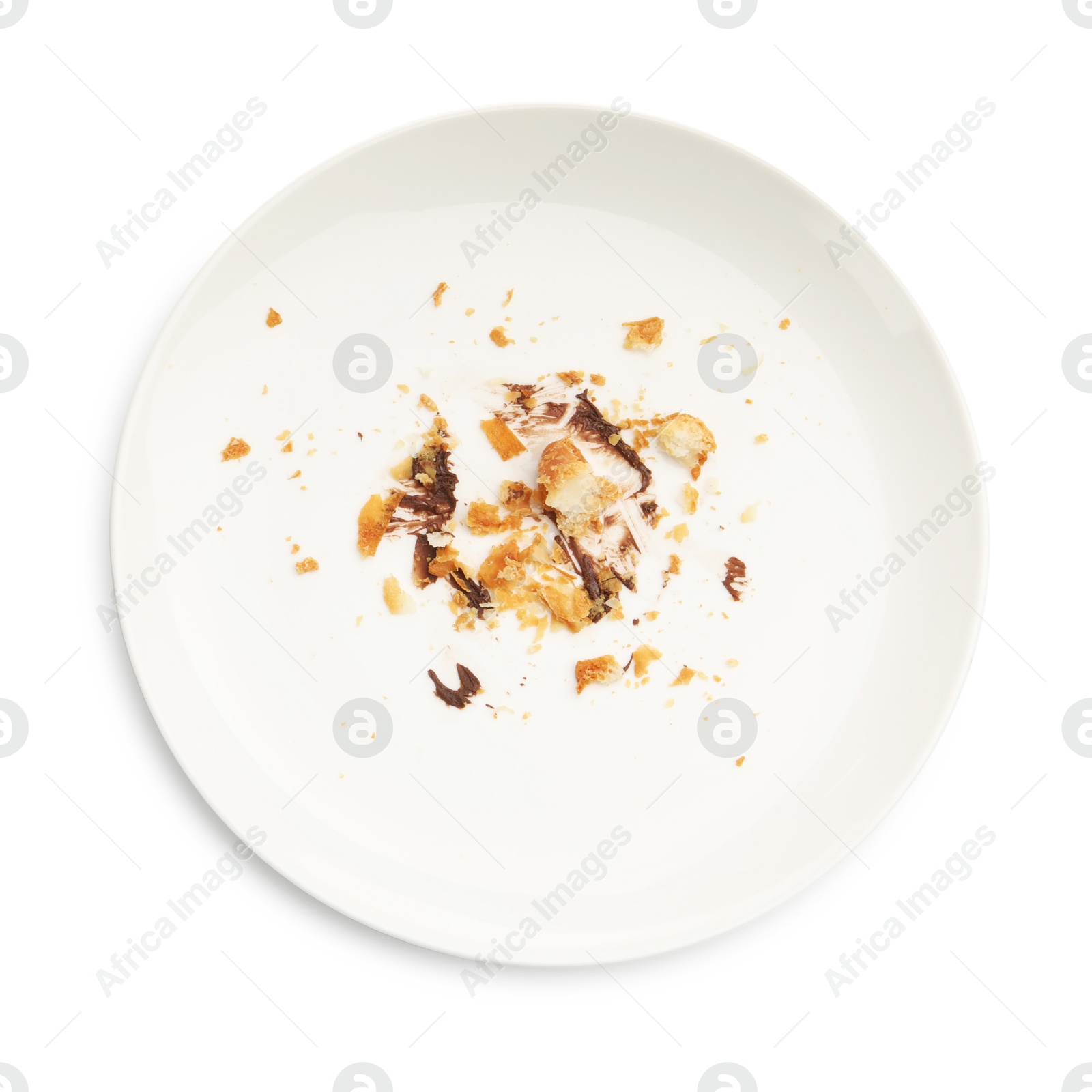 Dirty plate with crumbs and sauce isolated on white, top view Photo of Dirty plate with crumbs and sauce isolated on white, top view