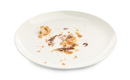 Photo of Dirty plate with crumbs and sauce isolated on white