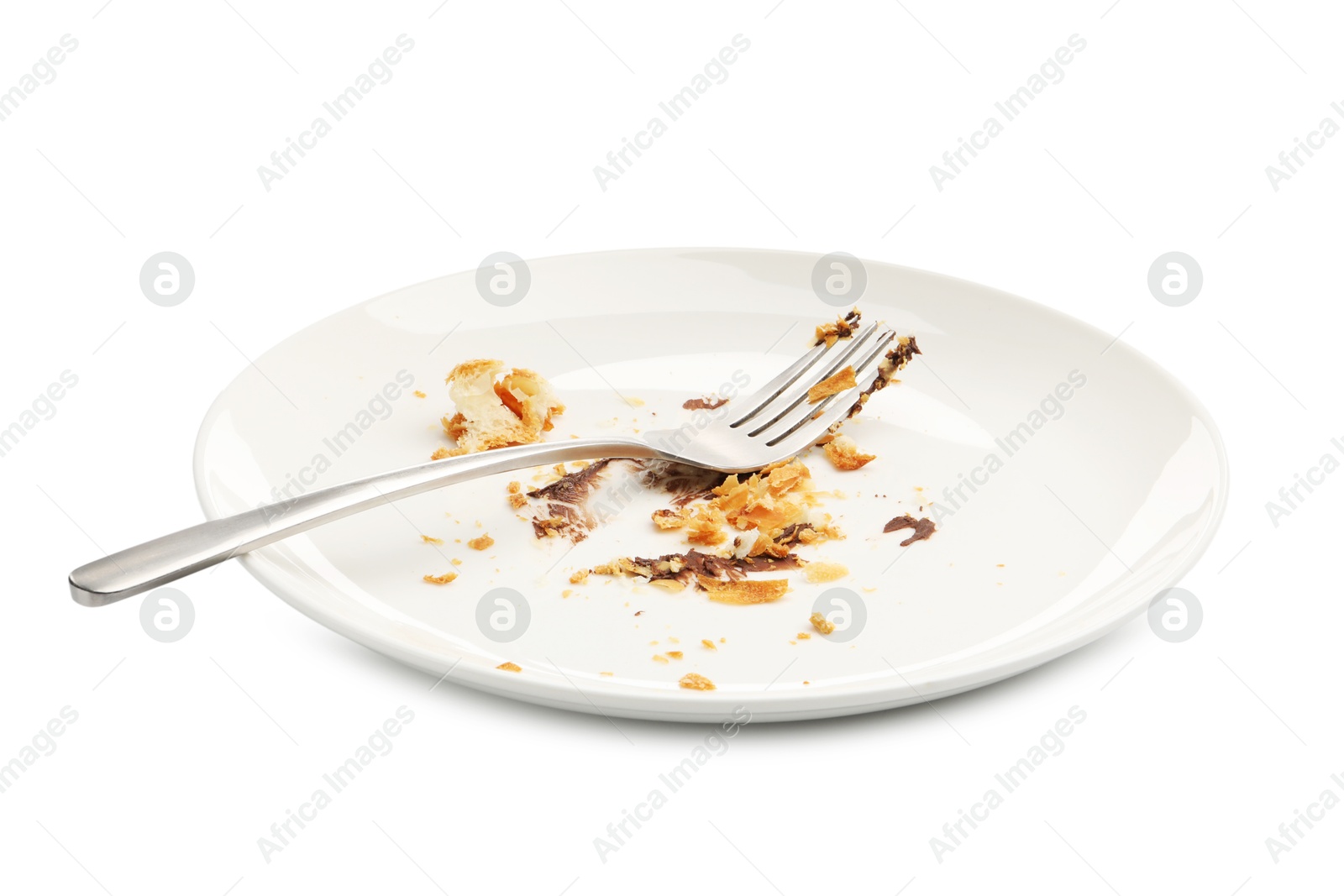 Dirty plate with crumbs, sauce and fork isolated on white Photo of Dirty plate with crumbs, sauce and fork isolated on white