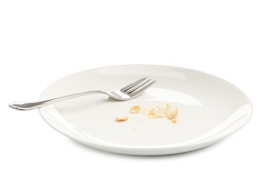 Photo of Dirty plate with bread crumbs and fork isolated on white