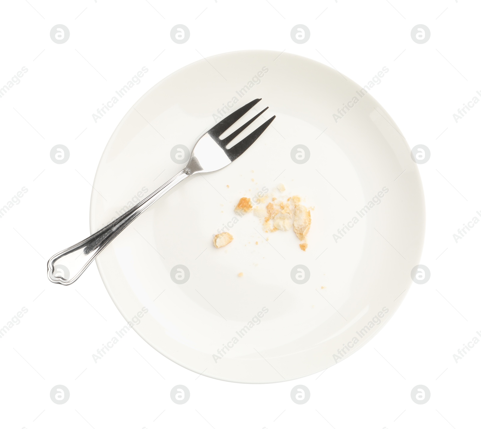Dirty plate with bread crumbs and fork isolated on white, top view Photo of Dirty plate with bread crumbs and fork isolated on white, top view