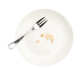 Photo of Dirty plate with bread crumbs and fork isolated on white, top view