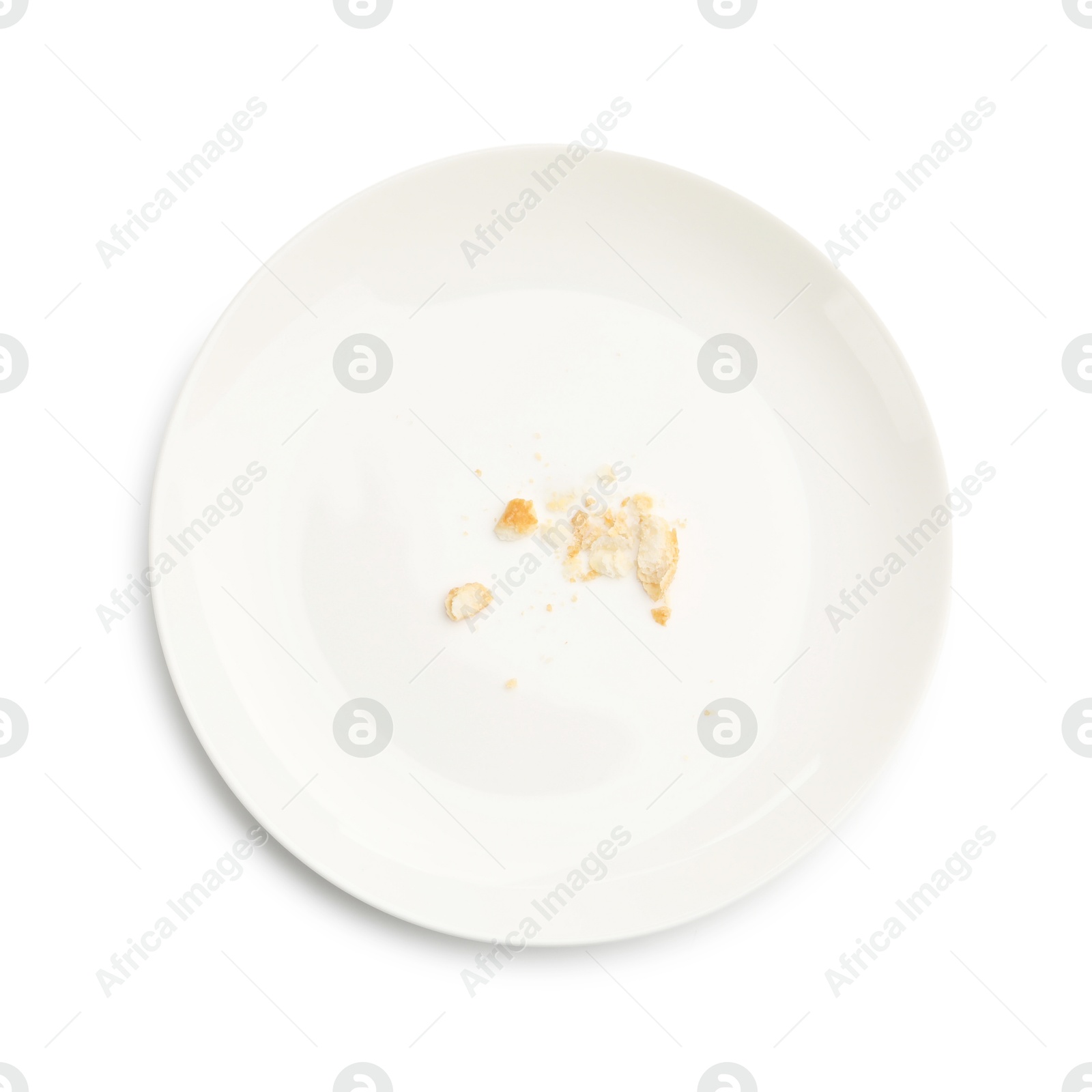 Dirty plate with bread crumbs isolated on white, top view Photo of Dirty plate with bread crumbs isolated on white, top view