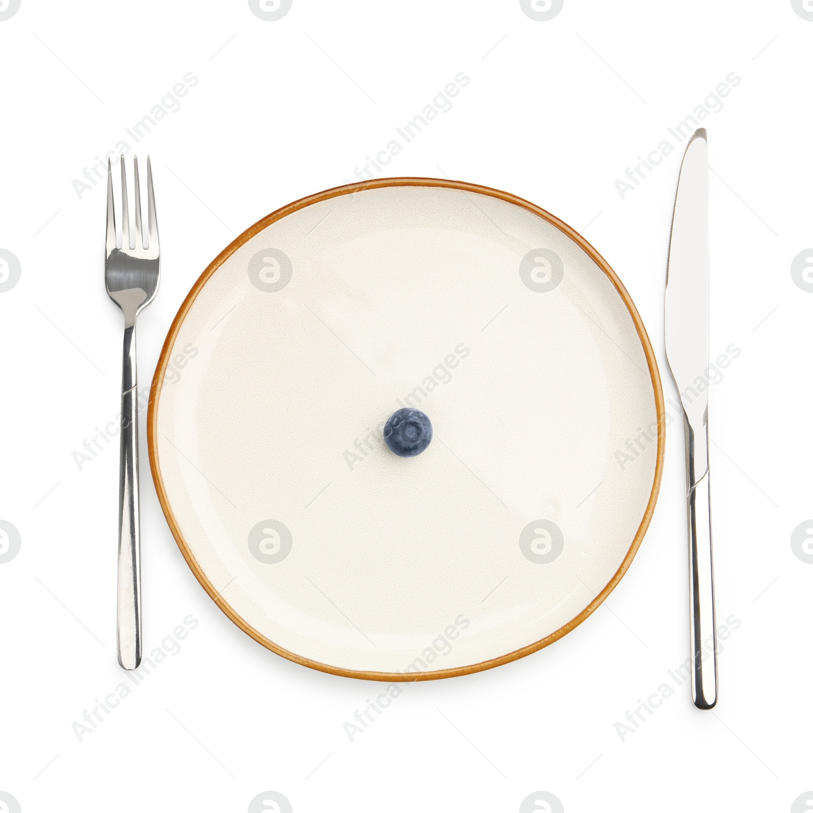 Plate with fresh blueberry and cutlery isolated on white, top view Photo of Plate with fresh blueberry and cutlery isolated on white, top view