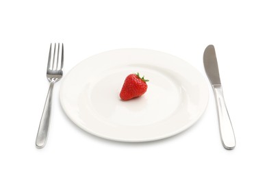Photo of Plate with fresh strawberry and cutlery isolated on white