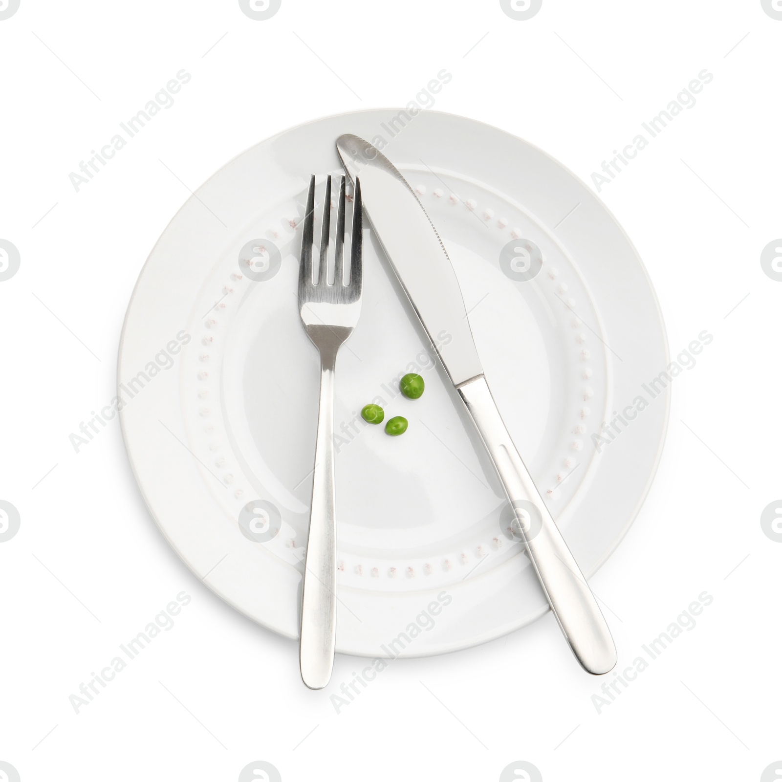 Plate with fresh green peas and cutlery isolated on white, top view Photo of Plate with fresh green peas and cutlery isolated on white, top view