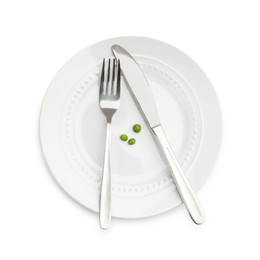 Photo of Plate with fresh green peas and cutlery isolated on white, top view