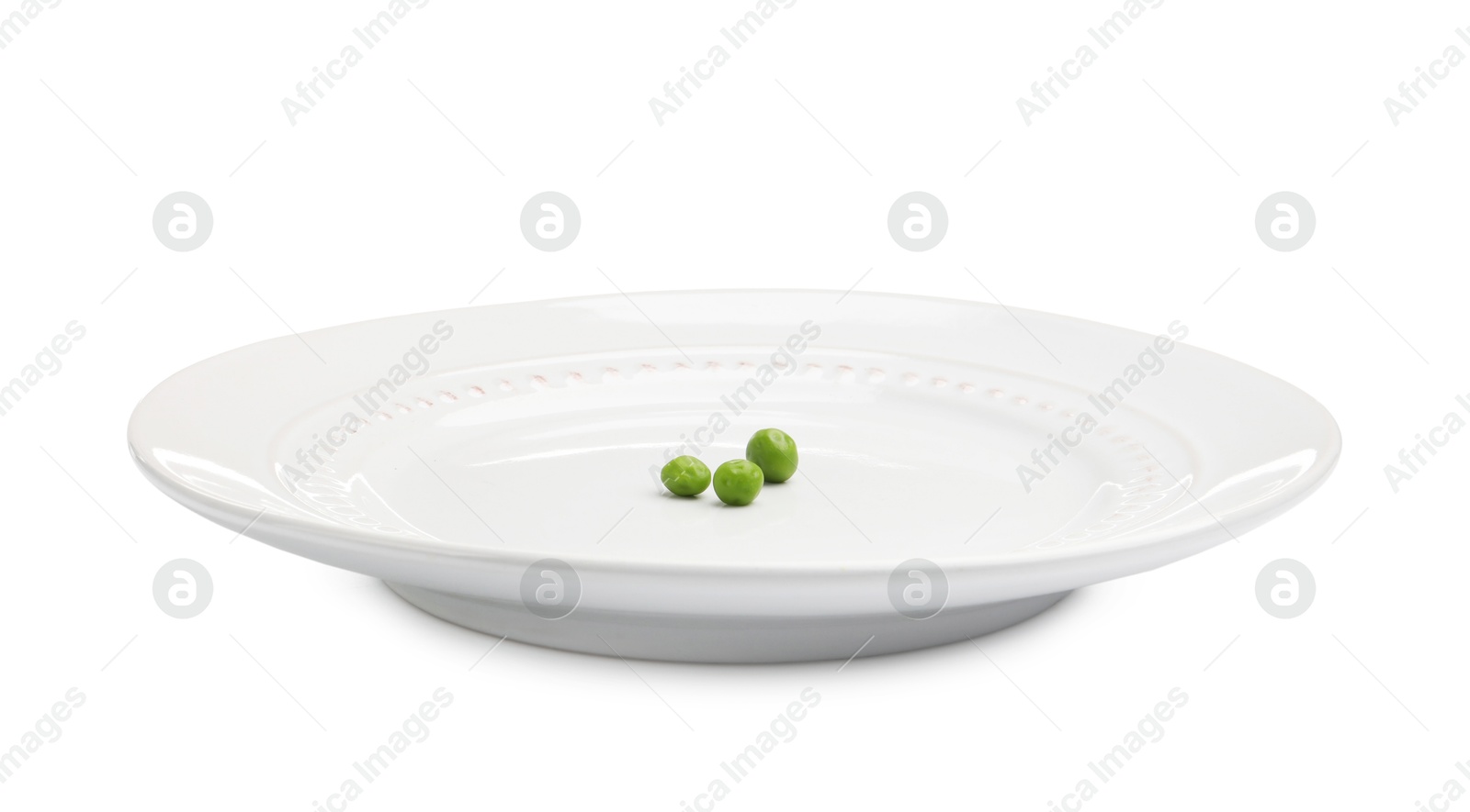 Plate with fresh green peas isolated on white Photo of Plate with fresh green peas isolated on white