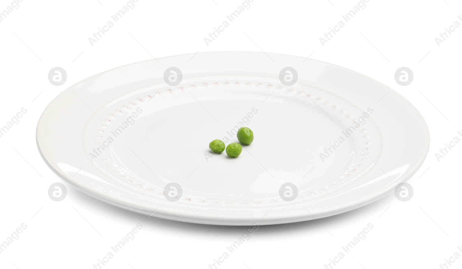 Plate with fresh green peas isolated on white Photo of Plate with fresh green peas isolated on white