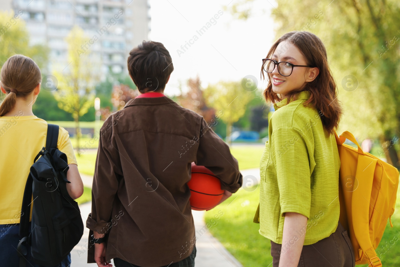 Three teenagers spending time together in park Photo of Three teenagers spending time together in park