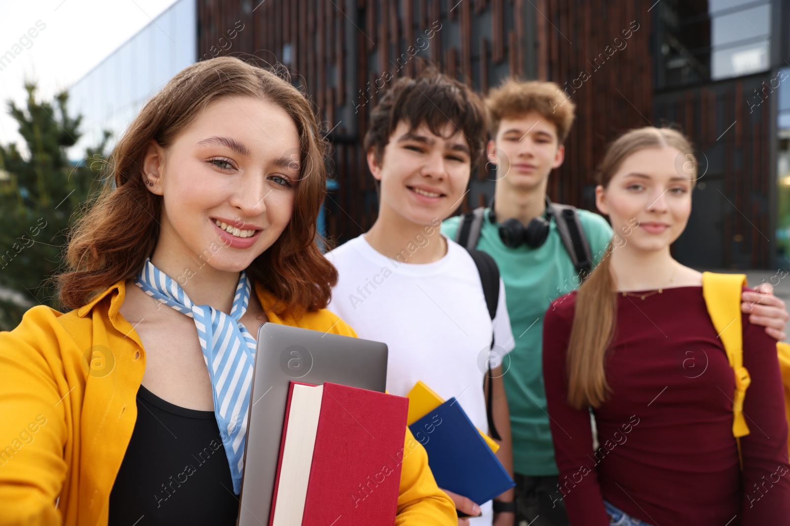 Group of happy teenagers taking selfie outdoors, selective focus Photo of Group of happy teenagers taking selfie outdoors, selective focus
