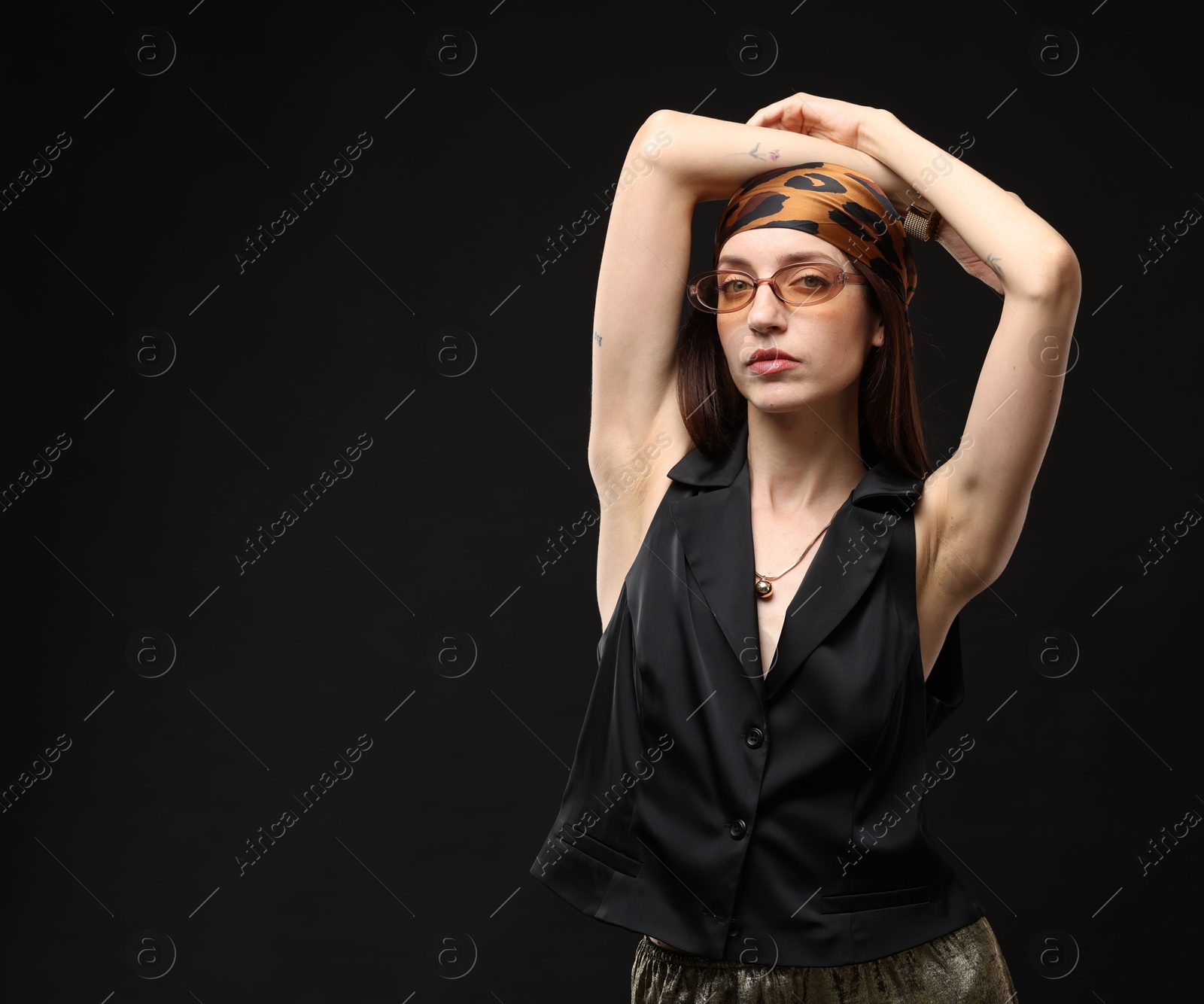 Portrait of beautiful woman in stylish outfit on black background, space for text Photo of Portrait of beautiful woman in stylish outfit on black background, space for text