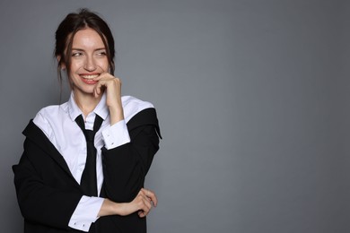 Photo of Portrait of beautiful woman in stylish outfit on light grey background, space for text