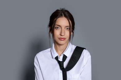 Photo of Portrait of beautiful woman in stylish outfit on light grey background