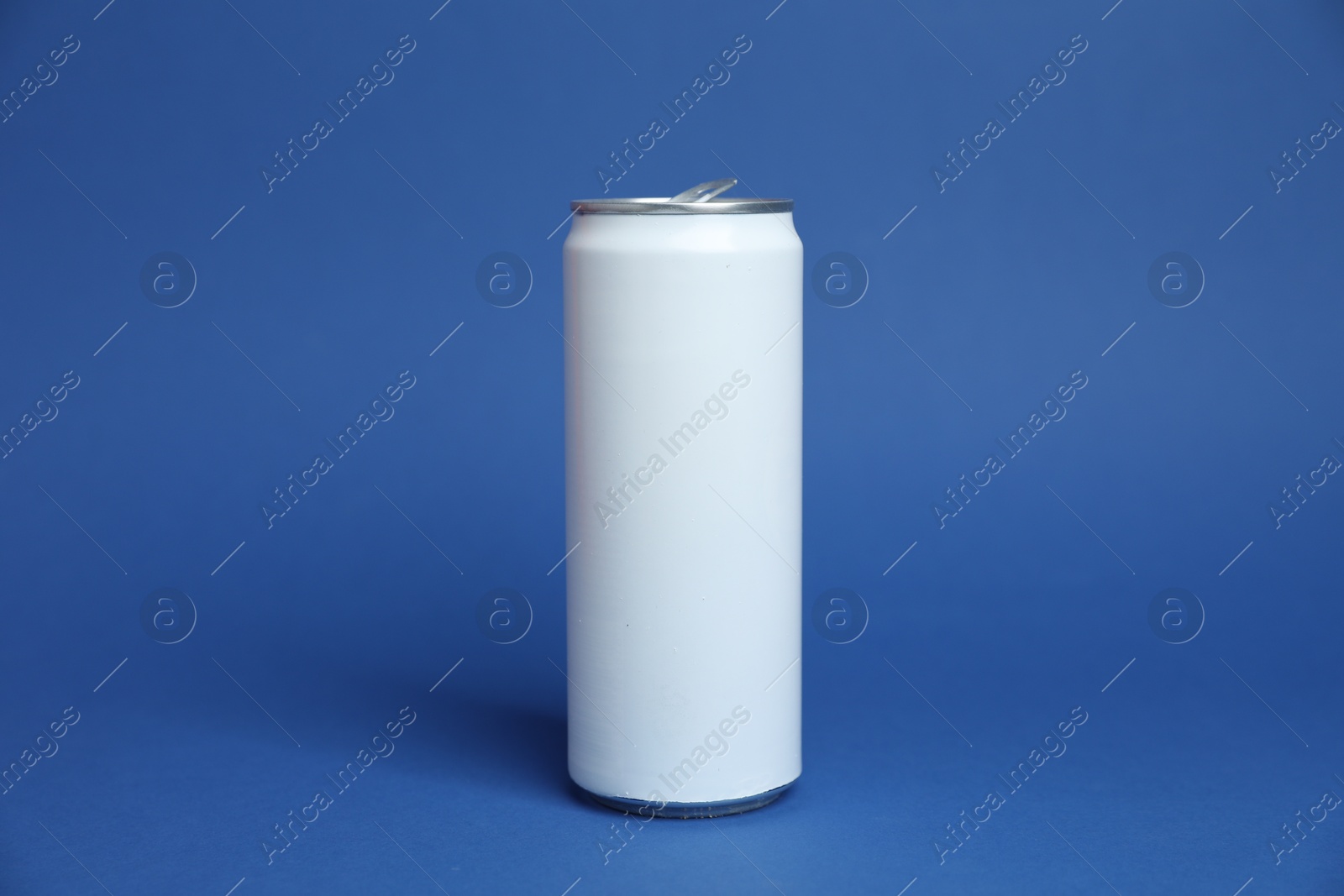 One white tin can on blue background Photo of One white tin can on blue background