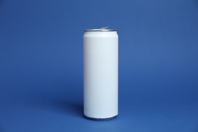 Photo of One white tin can on blue background