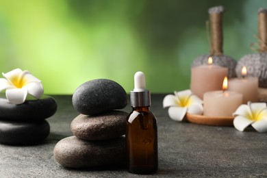 Photo of Composition with spa stones on grey table, closeup