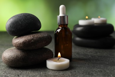 Photo of Composition with spa stones on grey table, closeup