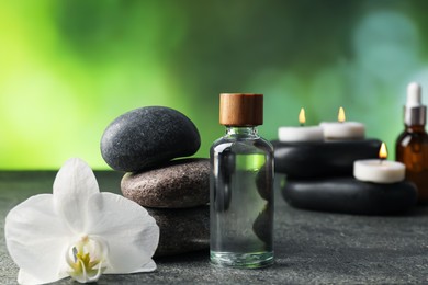 Photo of Composition with spa stones on grey table, closeup