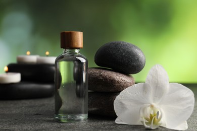 Photo of Composition with spa stones on grey table, closeup