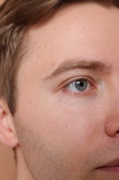 Photo of Handsome man with beautiful eyes, closeup view