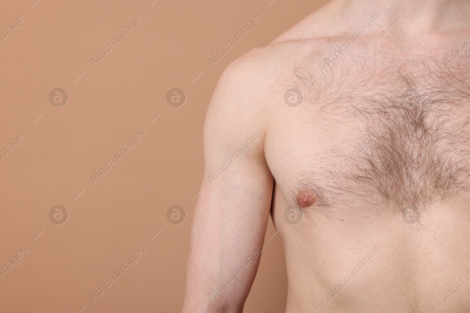 Man standing on beige background, closeup. Space for text Photo of Man standing on beige background, closeup. Space for text