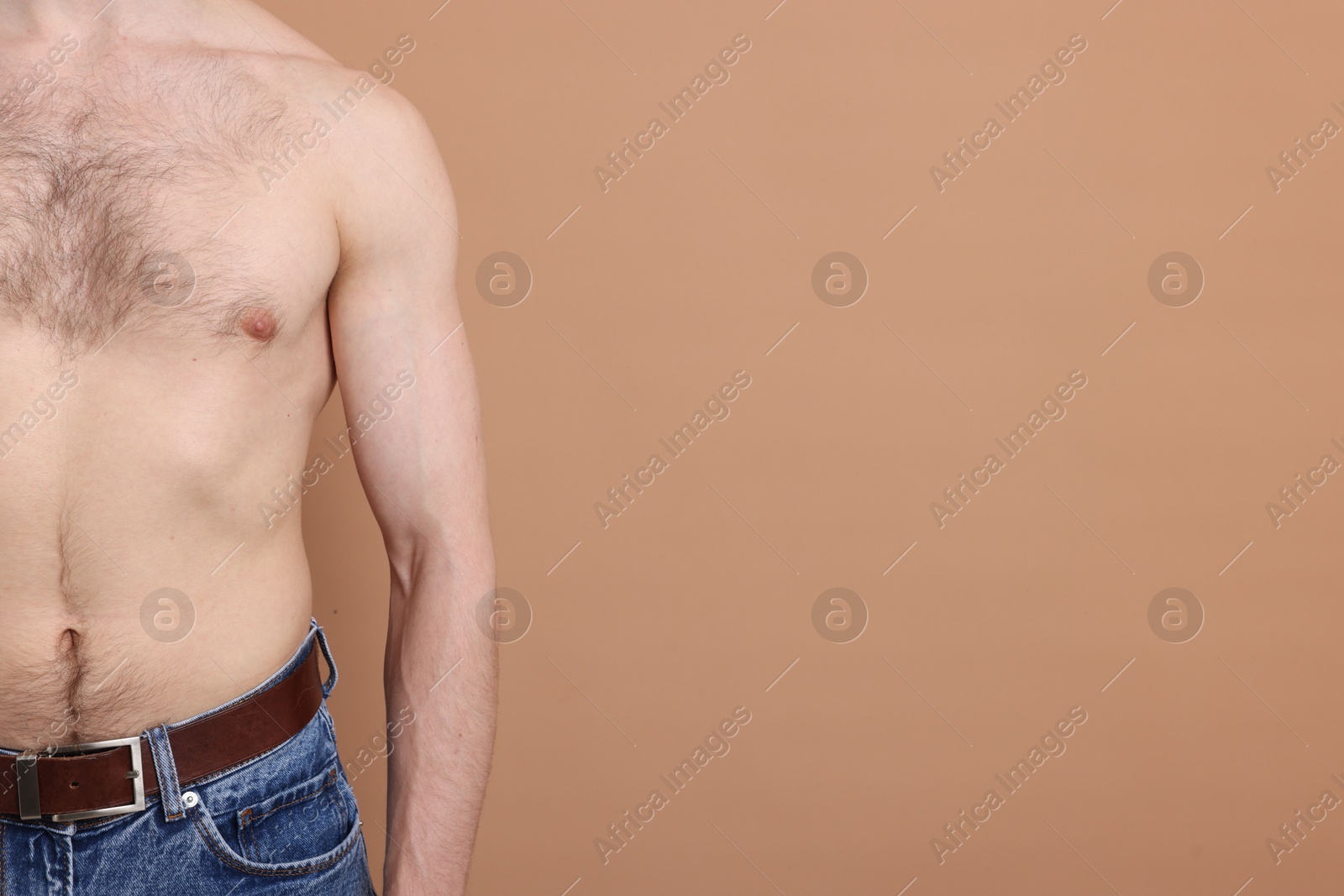Man standing on beige background, closeup. Space for text Photo of Man standing on beige background, closeup. Space for text