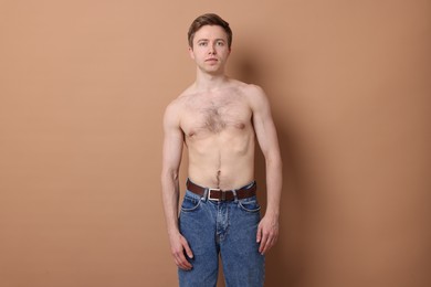 Photo of Man before scoliosis treatment on beige background