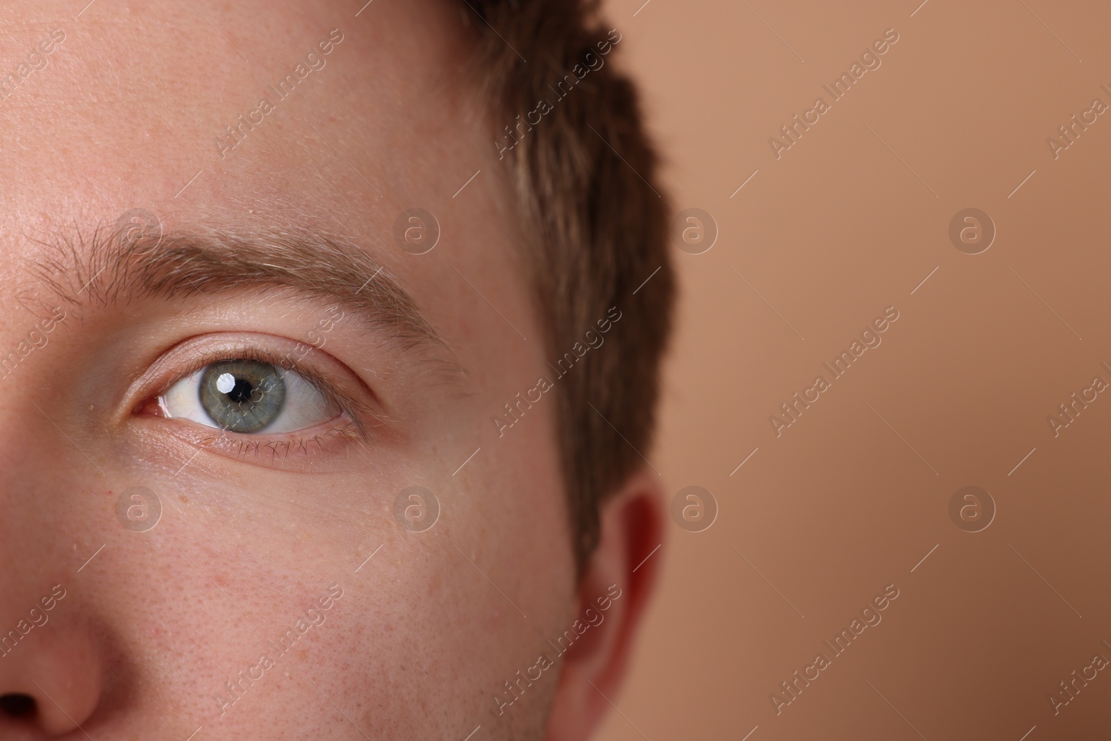 Man on beige background, closeup. Space for text Photo of Man on beige background, closeup. Space for text