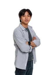 Photo of Portrait of handsome Asian man with crossed arms on white background